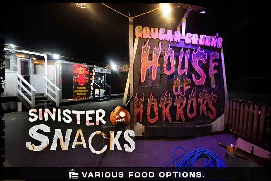 Night view of Sinister Snacks food stand at haunted house