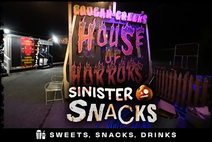 Night view of Sinister Snacks food stand at haunted house